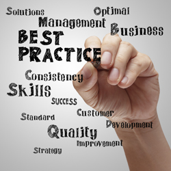 Hand writing ‘Best Practice’ and related management words