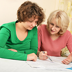Case worker with team leader reviewing documents