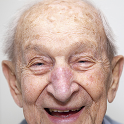 Close up of an older man’s smiling face