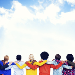 People with their arms around each other’s shoulders representing solidarity