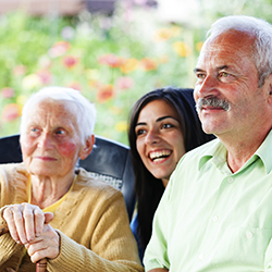 Three  people seated and smiling