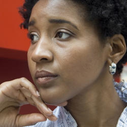 Profile of a woman from African descent with hand on her chin