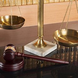 Legal scales and gavel on a table